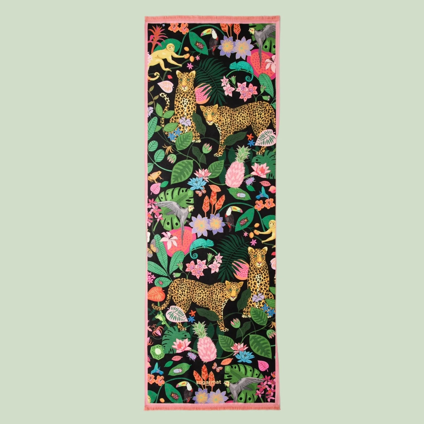 Decorative fabric panel with leopards and tropical plants on a white background