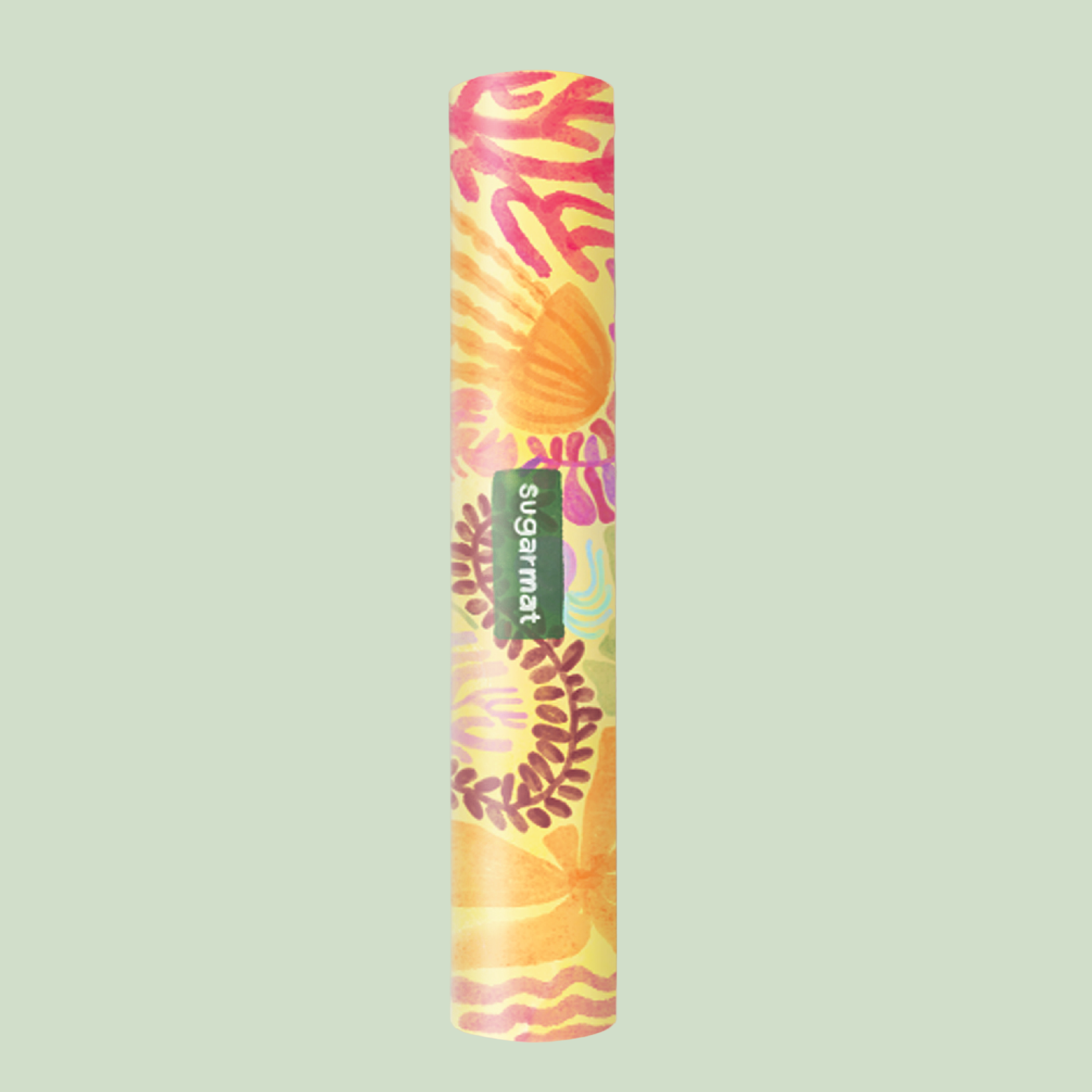 A yoga mat with a colorful design featuring what appears to be abstract sea creatures and sunset-like colors, rolled up and placed against a pink background.