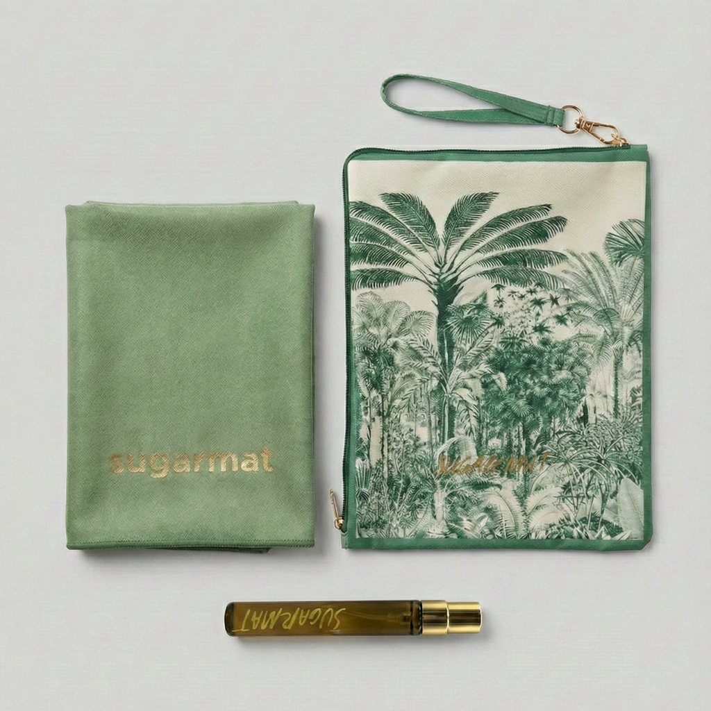 Green pouch with palm tree design, gold pen, and green fabric item on a light gray background