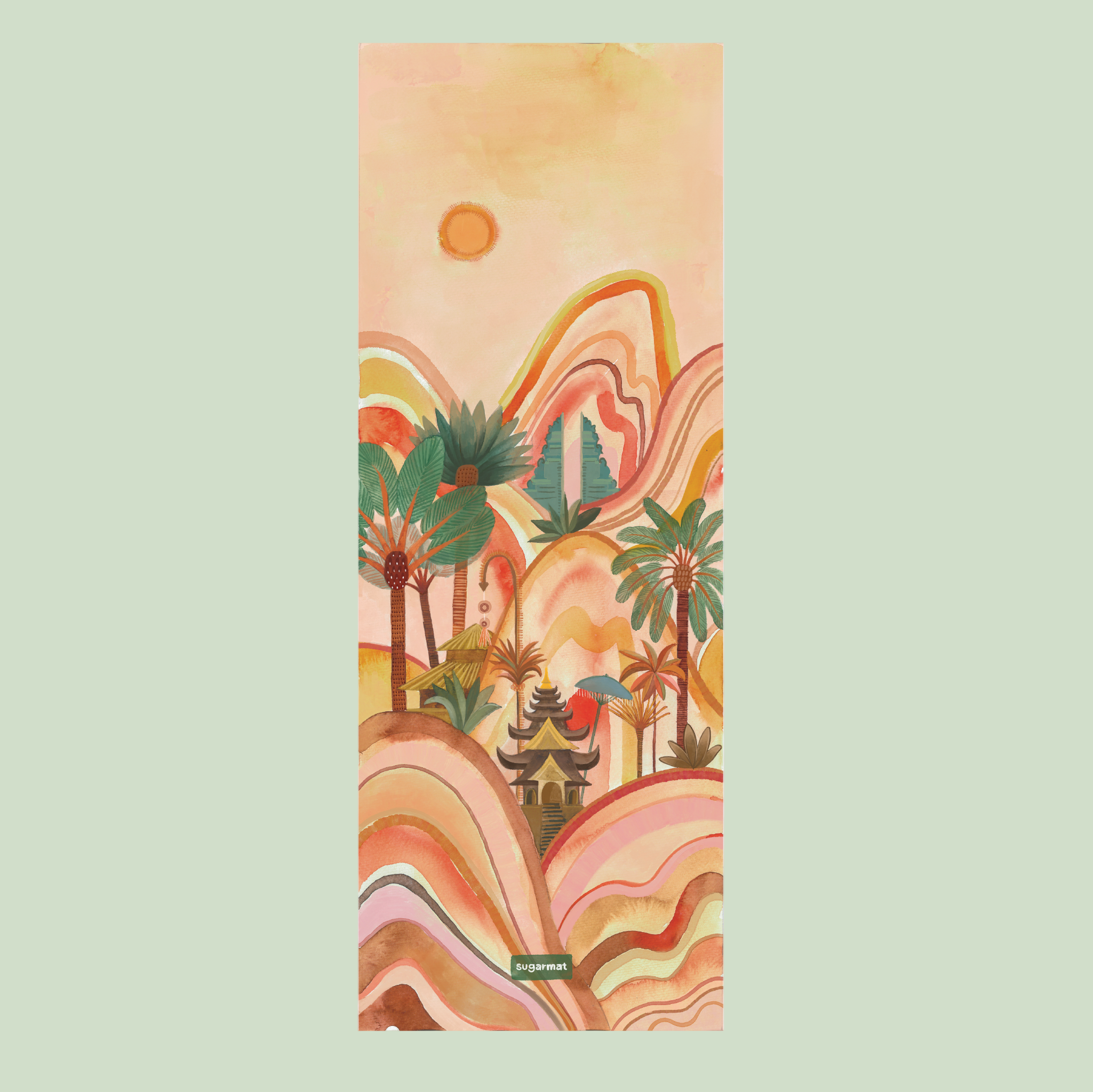 A yoga mat with a colorful design featuring mountains, the sun, and palm trees.