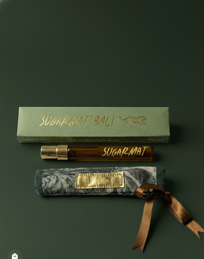Sugarmat Bali products including a box, rollerball, and packaging on a dark green background