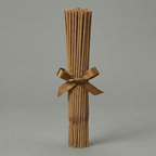 Bamboo sticks tied with a ribbon on a gray background