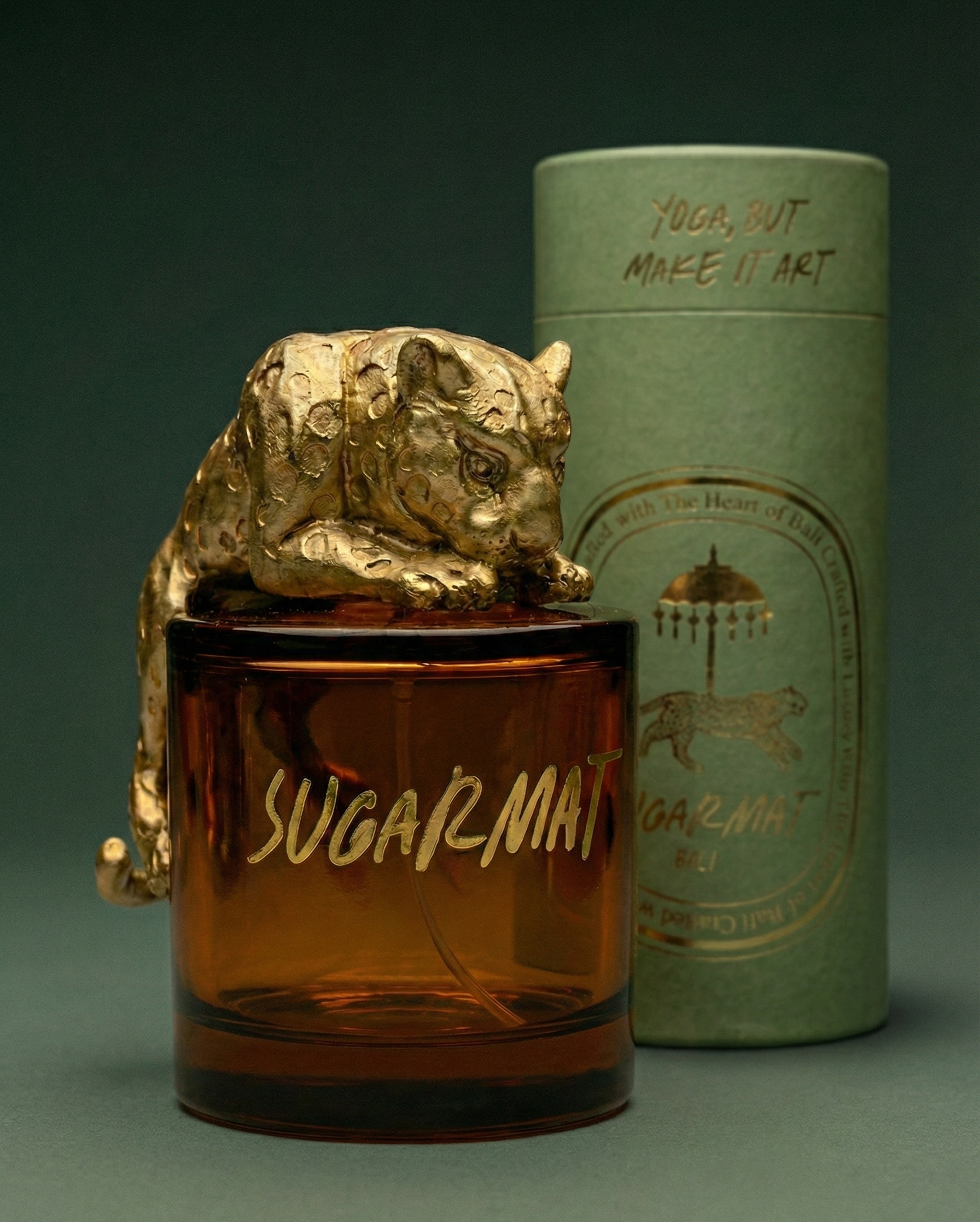 Sugarmat product with gold panther design and green cylindrical container on a dark background