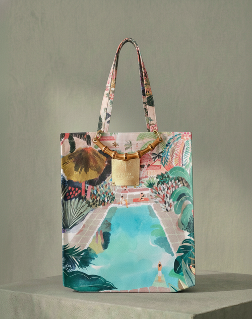 Colorful tote bag with artistic design on a gray background