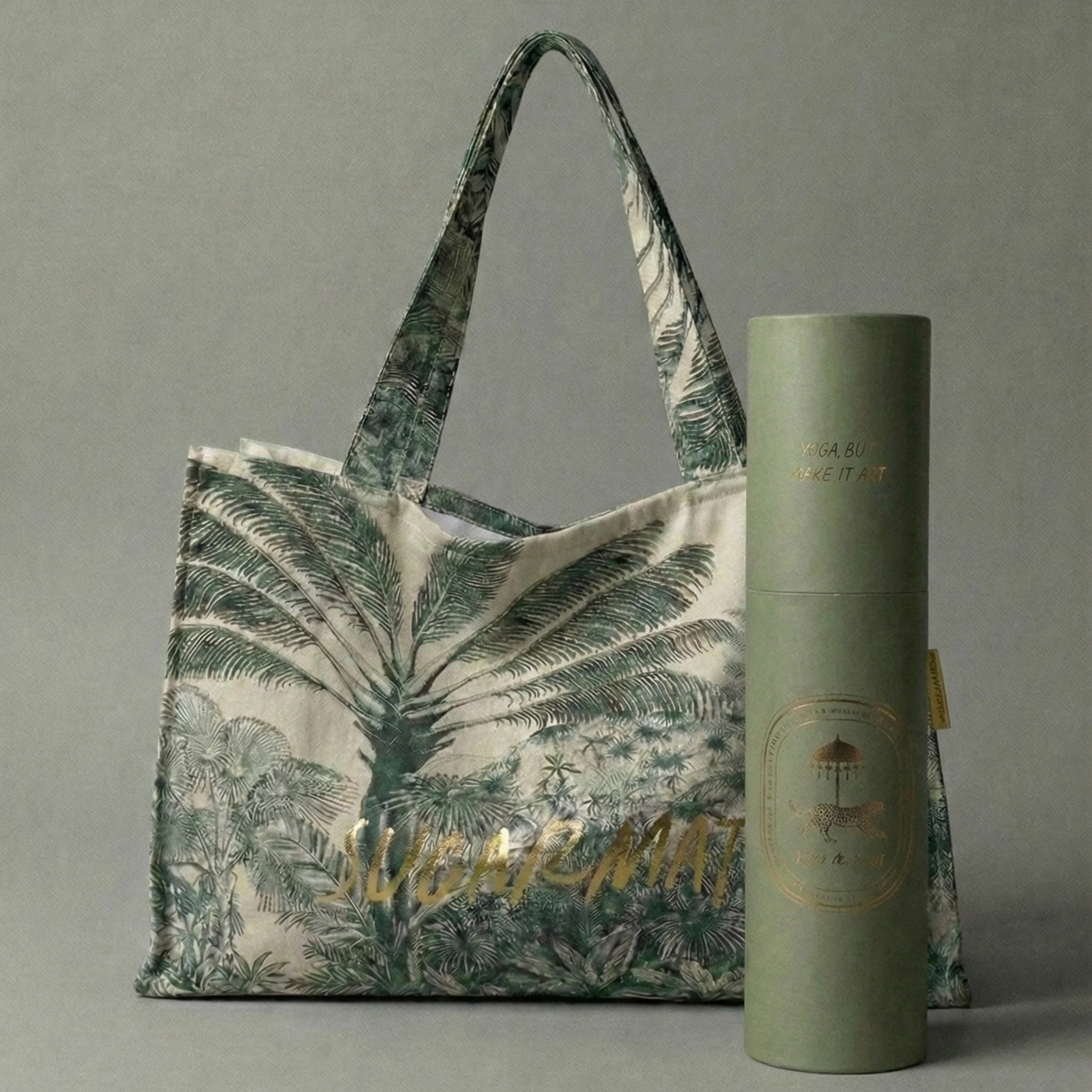 Tote bag with palm leaf design and green yoga mat on a gray background