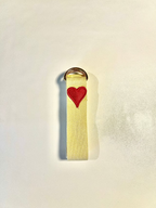 Yellow strap with a red heart emblem on a light gray background