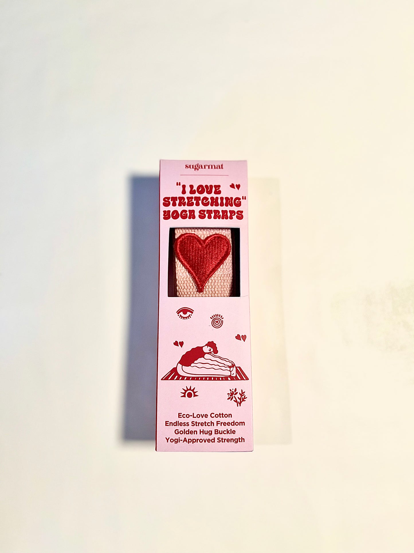 Product packaging with heart design and text on a light background