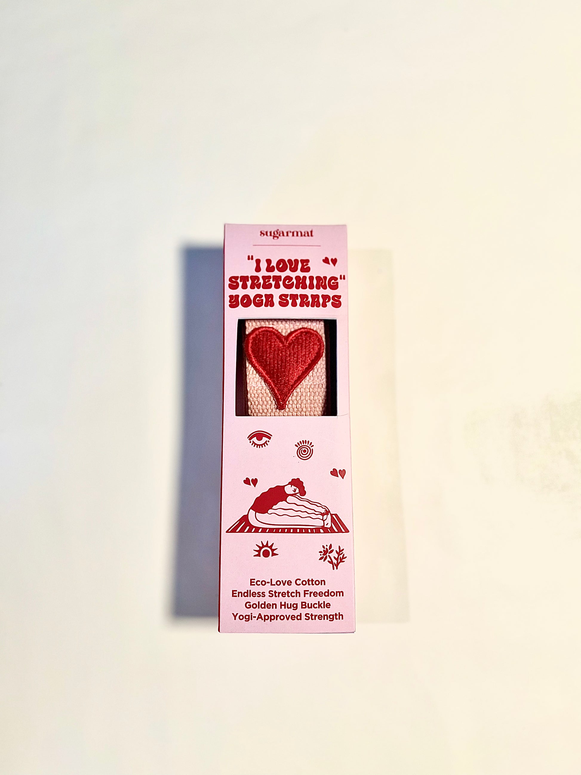 Product packaging with heart design and text on a light background