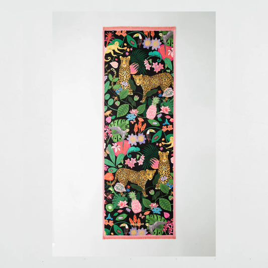 Decorative fabric panel with leopards and tropical plants on a white background