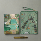 Two green handbags with artistic designs on a gray background